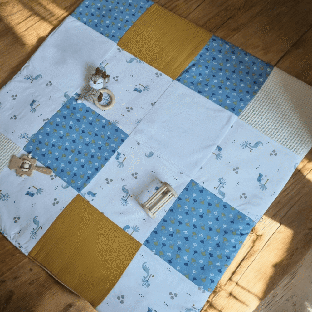 Le tapis de jeu dino bleu - pliable et sensoriel, dès la naissance